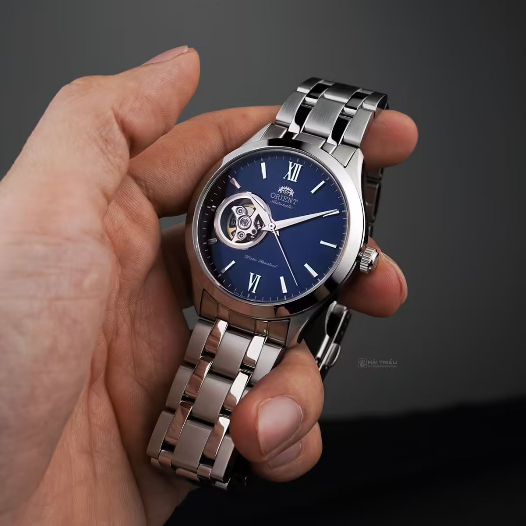 Đồng hồ Orient Golden Eye 2 mặt xanh open heart thanh lịch